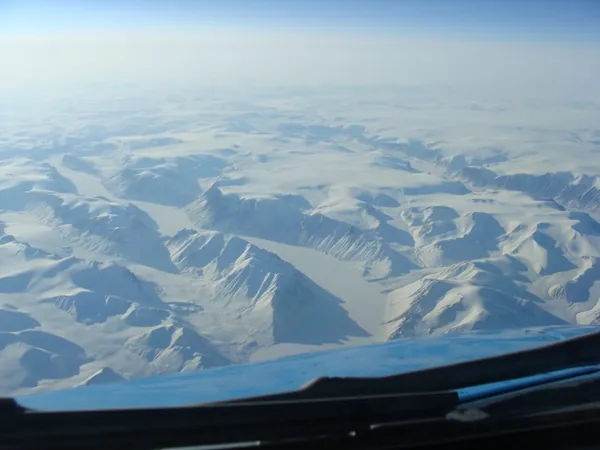 Snow-covered mountains and glaciers over Greenland en route to Vancouver.