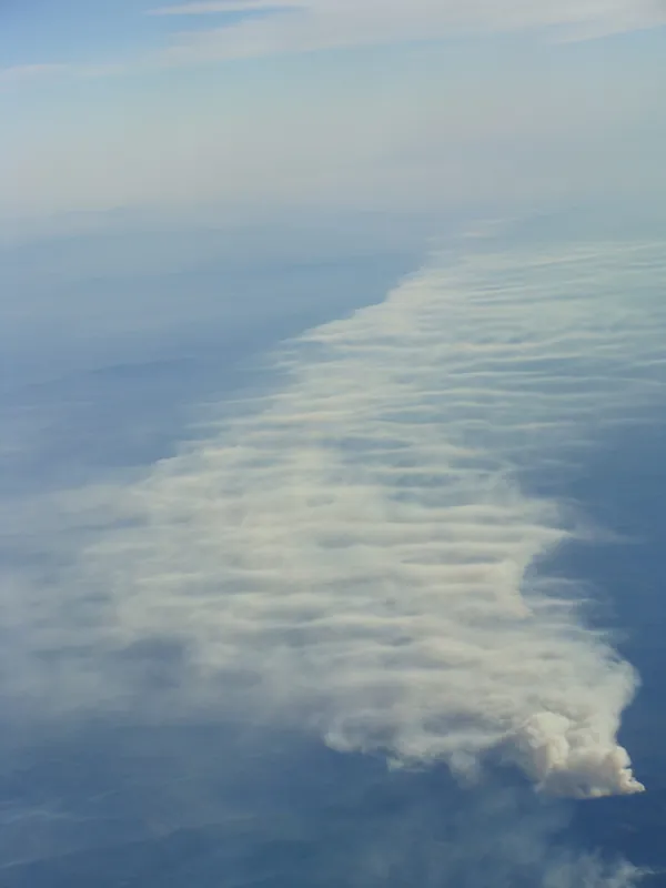 A single wildfire outside San Francisco, spreading into a blanket of smoke.