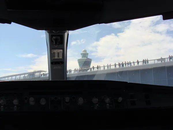 Spotters spotted: the roles are reversed at Schiphol.