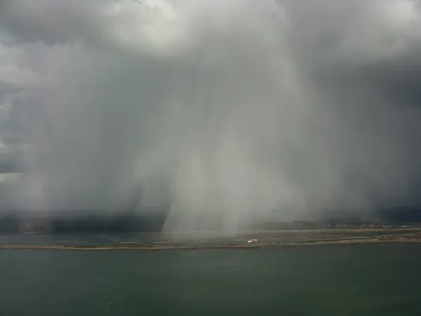 Rain shower like a smoke screen, next to Vancouver airport.