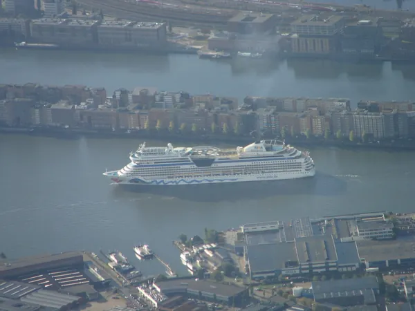 Amsterdam, a cruise ship sailing past Java Island.