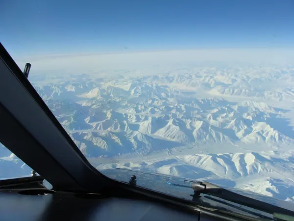 Snow-covered mountains and glaciers over Greenland en route to Vancouver.