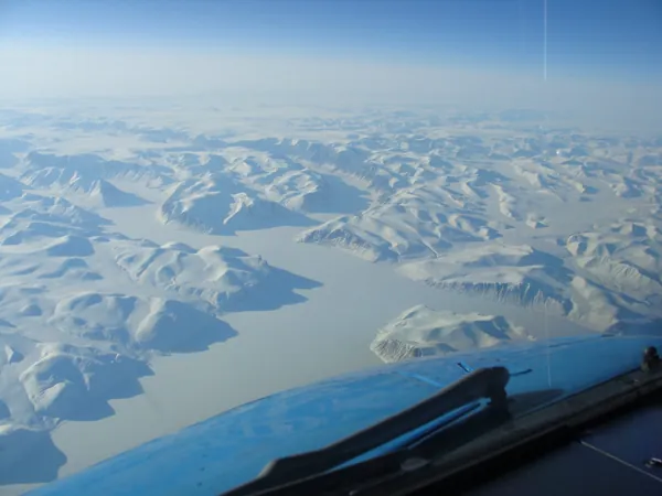 Snow-covered mountains and glaciers over Greenland en route to Vancouver.