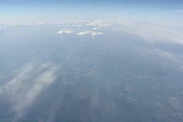 South of the winding Rhine: Düsseldorf Airport. North of it: the Ruhr, throwing up industrial plumes like tornadoes.